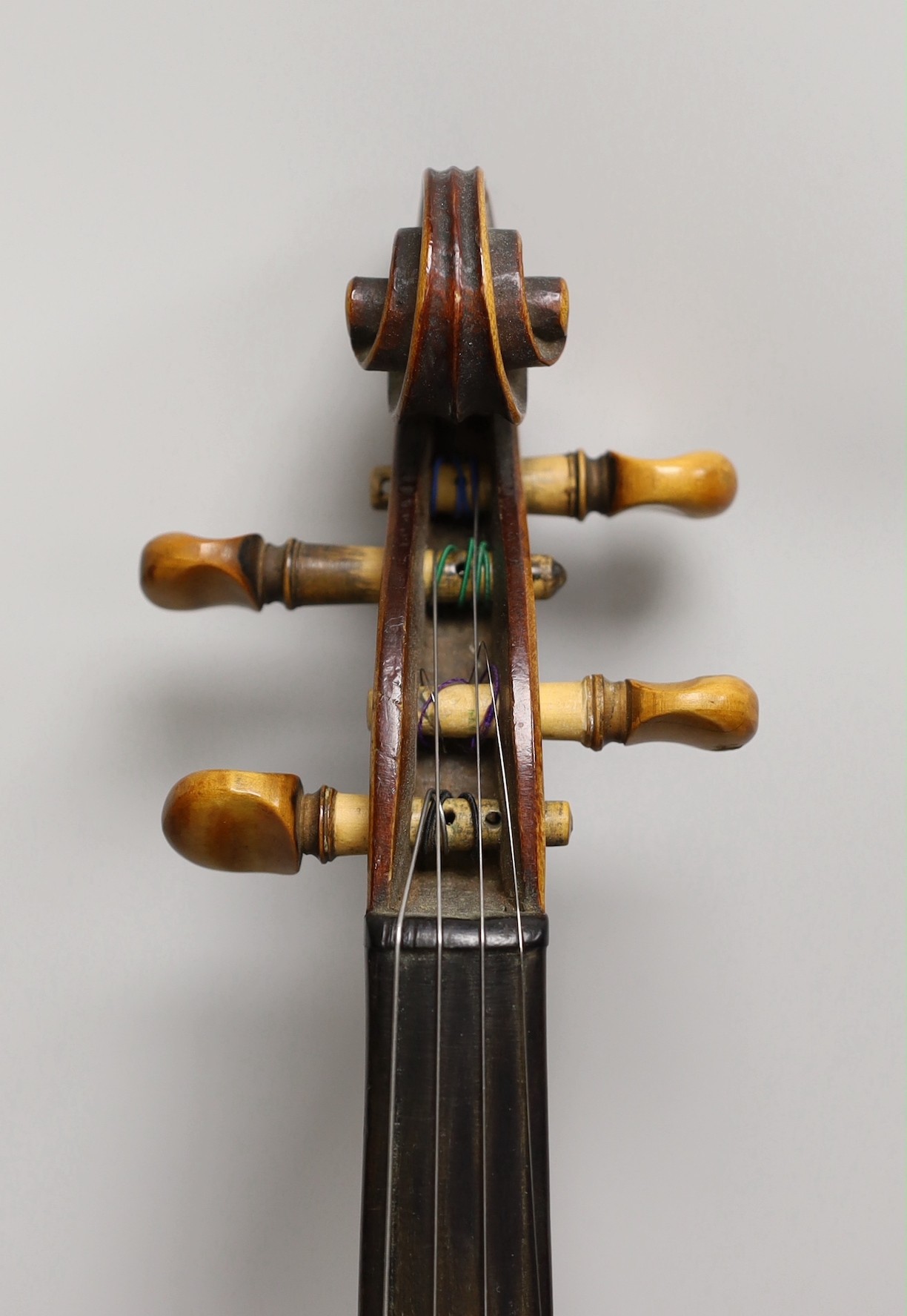 A French single back violin, interior label reads ‘Médio Fino’, back measures 35.5cm excl button. With case and bow